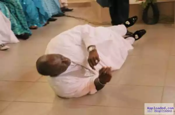 Dino Melaye pictured rolling on the ground in white agbada during Thanksgiving Service (pics)